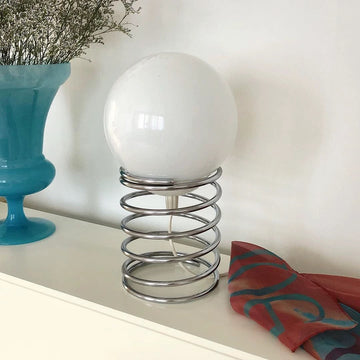Overhead shot displaying the lamp's compact footprint on a desk
