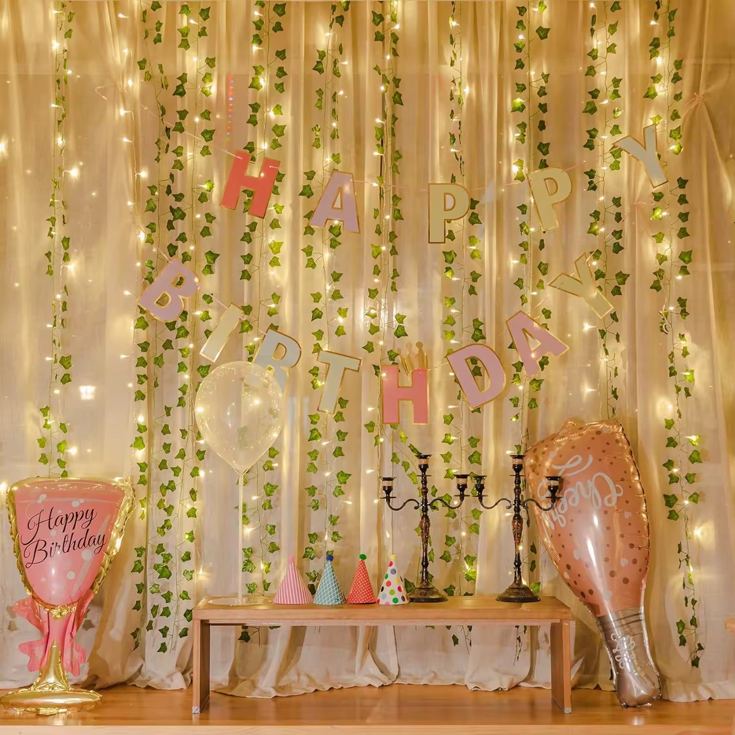 Artificial vine with realistic leaf texture and embedded LED lights glowing softly.