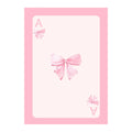 Cherry wall art print with ribbon bow detail styled above a cream couch.