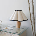 Artistic wooden table lamp with vintage pleated shade. Romantic bedside light for bedroom and living room decor.