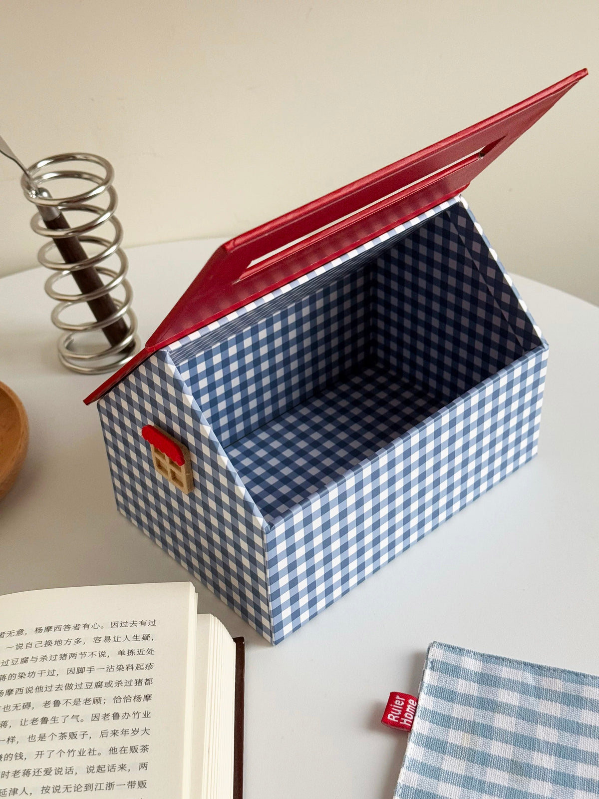 Open blue checkered tissue box cover showing the inner compartment and red roof