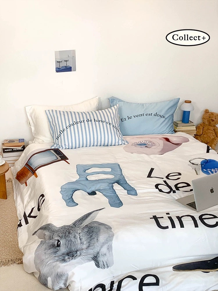 Blue rabbit duvet cover with oversized rabbit artwork and graphic lettering