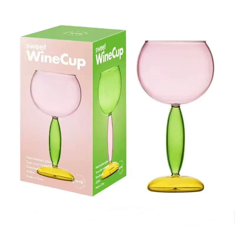 Colorful wine glass with a matching packaging box on a white background