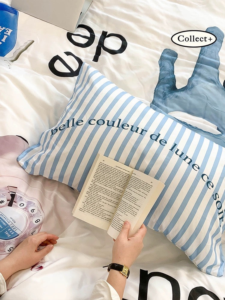 Blue rabbit duvet cover with oversized rabbit artwork and graphic lettering