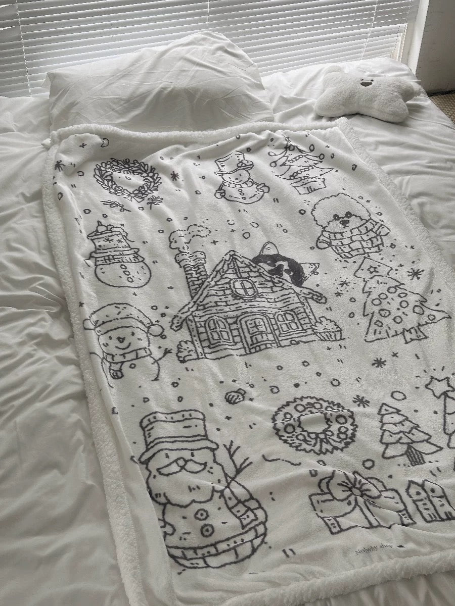 Christmas flannel blanket with a snowy winter line-art print spread out on the bed
