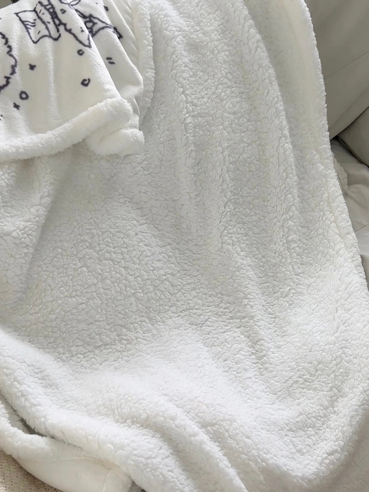 Christmas sherpa fleece blanket reverse showing the soft white sherpa texture