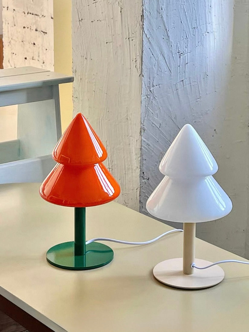 Colorful Christmas tree night lamp in orange and blue styled on a tabletop