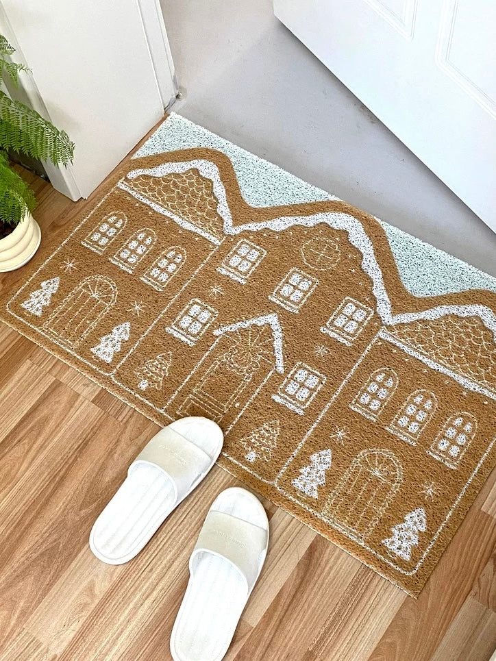 Cinnamon gingerbread doormat on wood flooring with white slippers