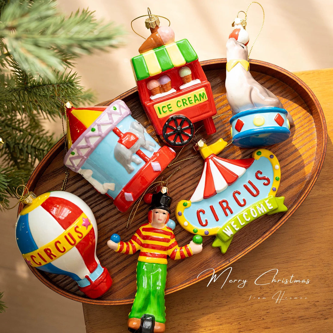 Circus ornaments in six glossy designs include a carousel, clown, seal, balloon, sign and ice cream cart.