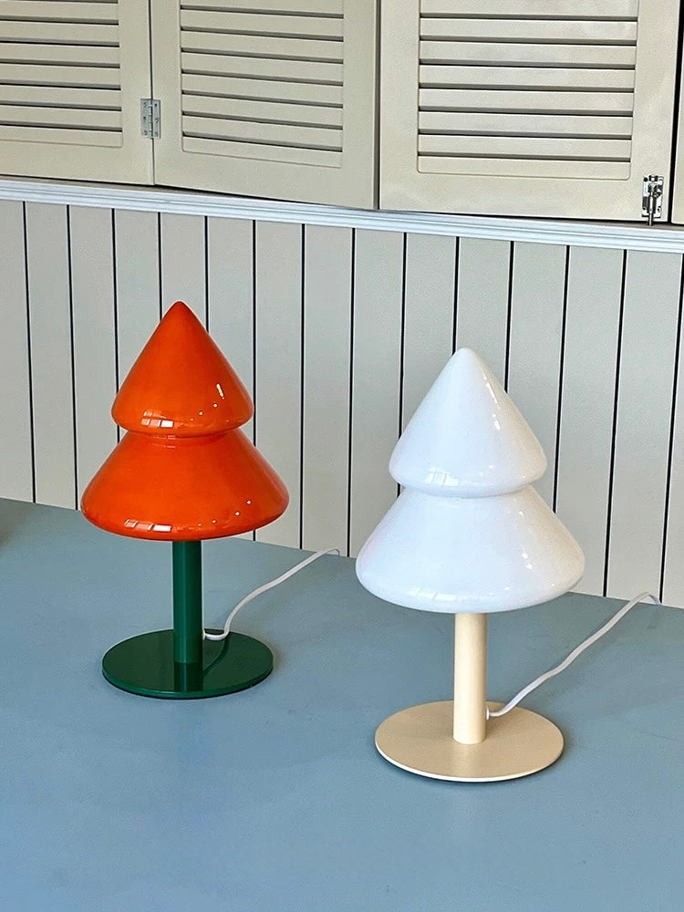 Colorful Christmas tree night lamp in orange and blue styled on a tabletop