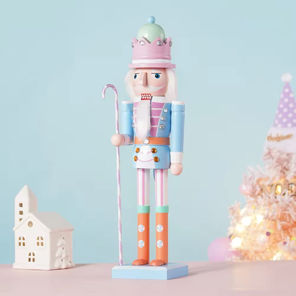 Colorful nutcracker soldier with hand-painted details. Durable wooden decoration for tree, mantel, or gifting.