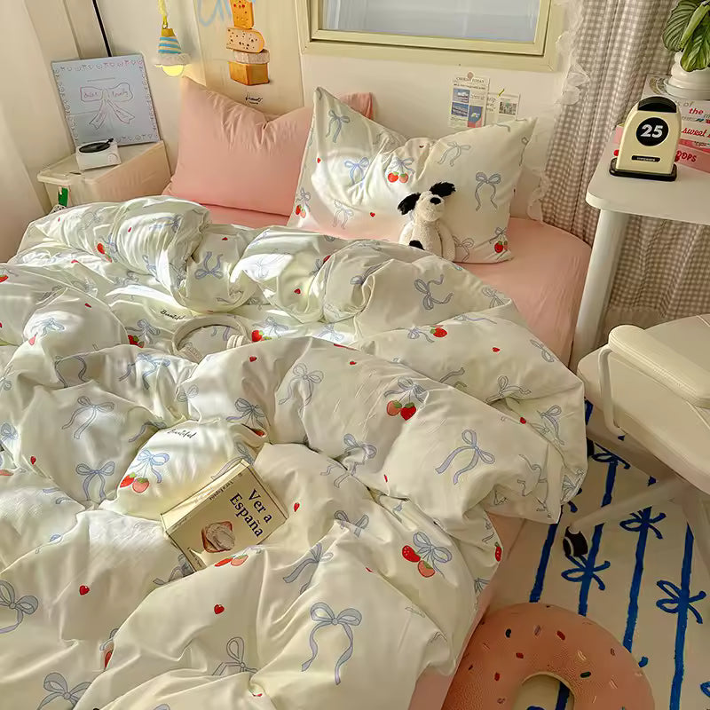 Coquette cherry bow bedding set on a soft pink bed, styled for a dreamy soft girl room.