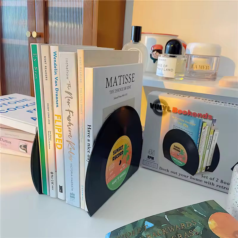 Vinyl record bookends with books on a shelf