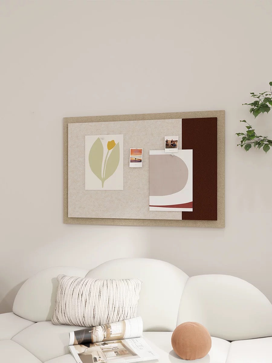 Cream and brown pin board for wall displayed above a white bed