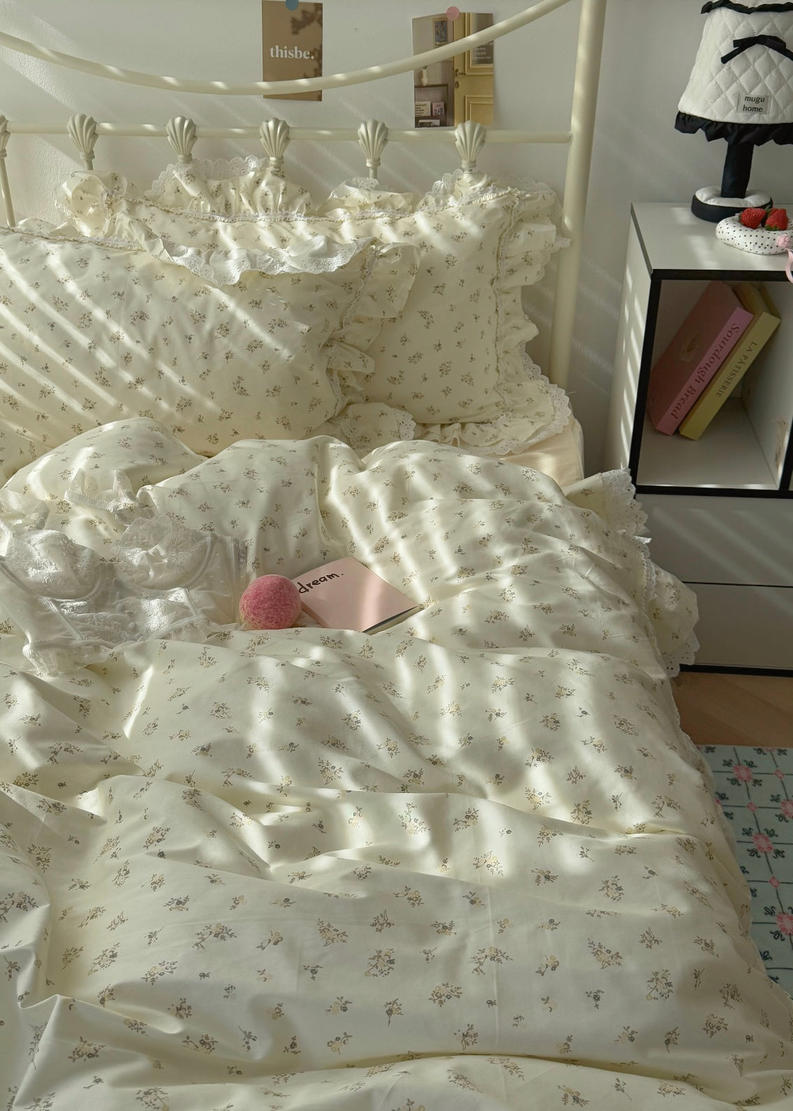 Bed with white floral bedding in a bedroom setting