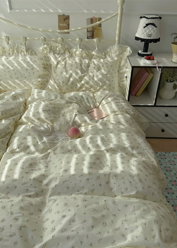 Bed with floral-patterned bedding in a softly lit bedroom.