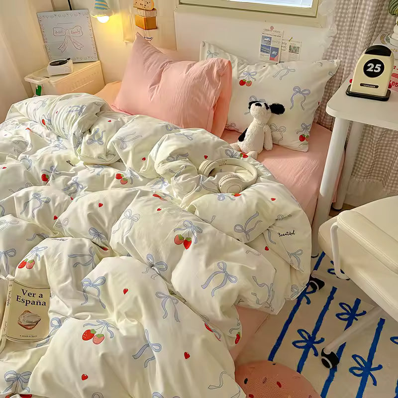 Soft girl aesthetic bedding with blue bows and strawberries, perfect for cute dorm decor.