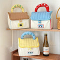 Adorable house-shaped makeup bag in kawaii cottagecore style with zipper and soft handle, ideal for skincare and toiletries