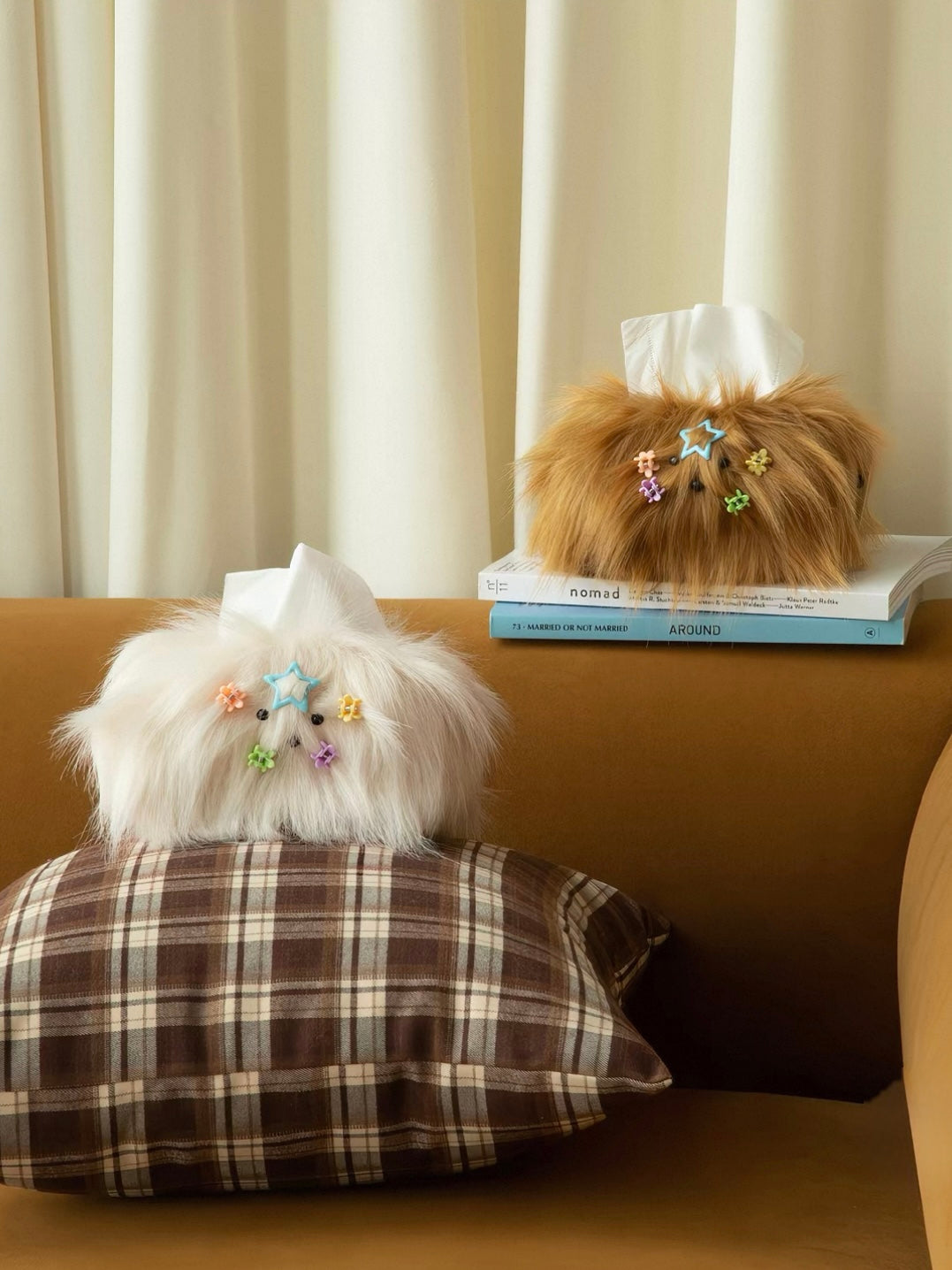 A cute tissue box cover in Cream White rests on a plaid cushion, with the Caramel cover raised behind it.