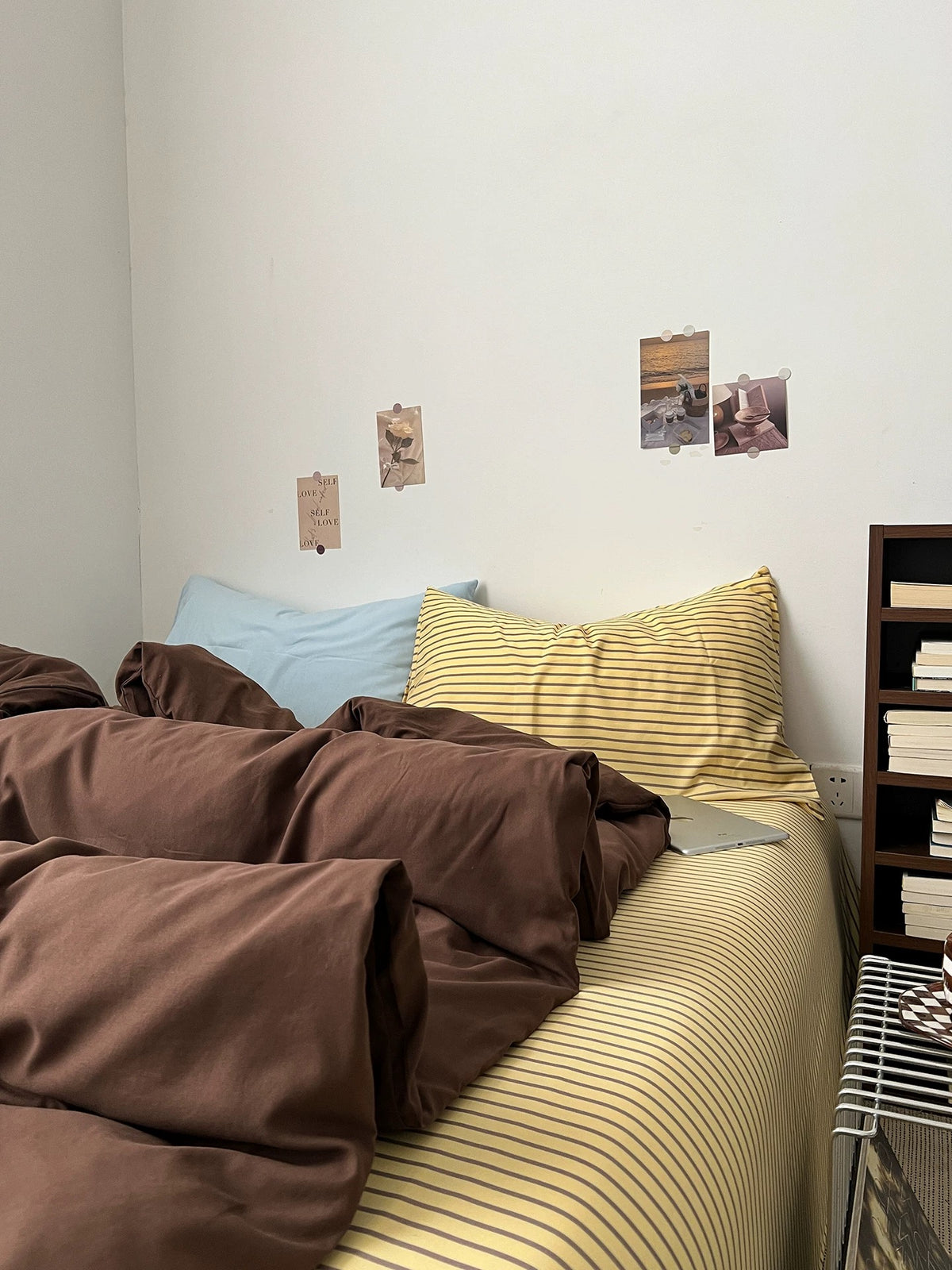 Dark brown bedding with solid duvet cover and fine striped flat sheet