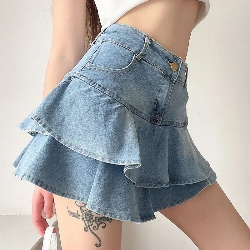 Y2K coquette vintage denim skirt with high-waist A-line design and pleated ruffles. Stylish blue mini skirt for women’s retro summer looks.