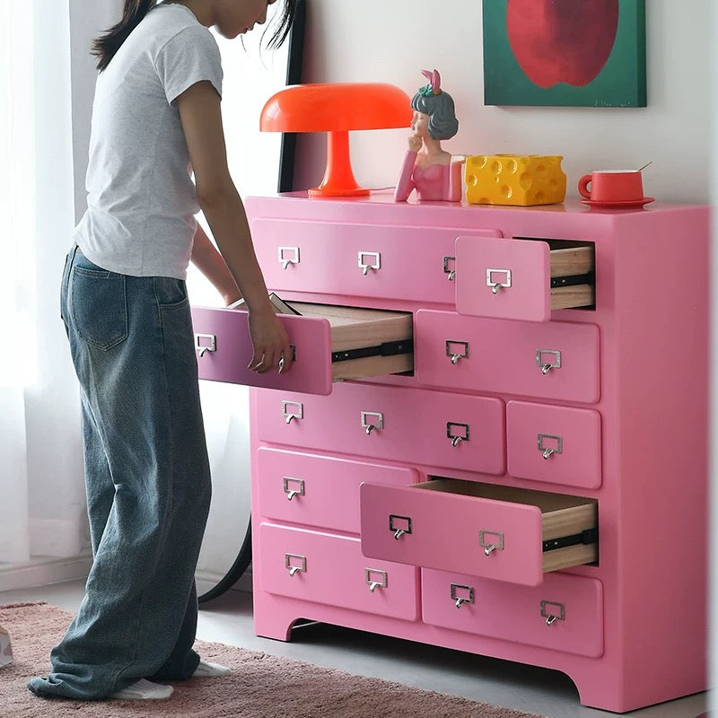 Pink dopamine ten drawer storage cabinet styled in pastel aesthetic bedroom interior space