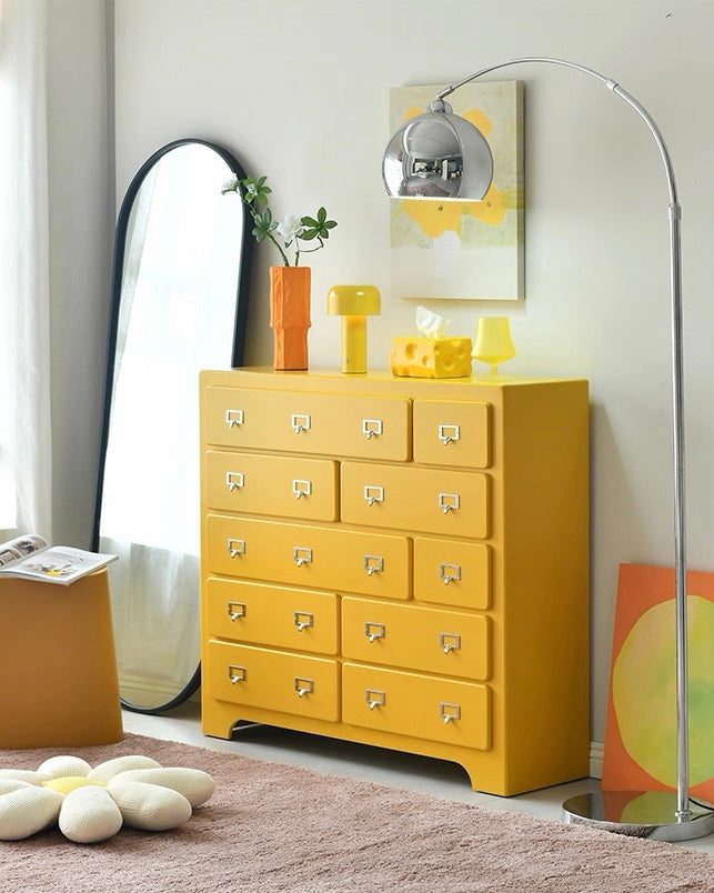 Dopamine pink storage cabinet adding playful color to organized bedroom interior