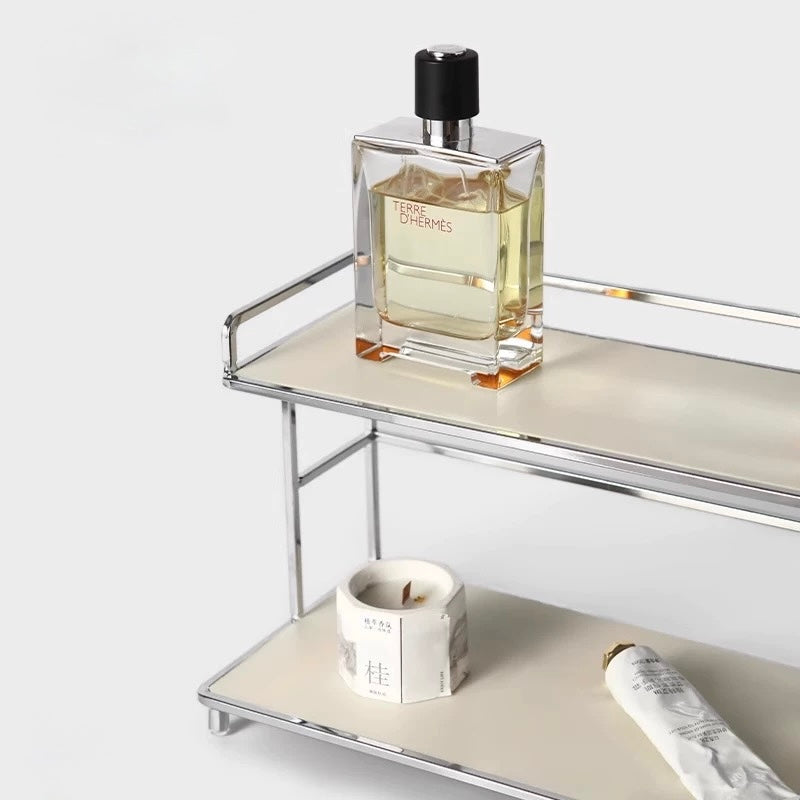 Perfume bottle on a metal shelf with a white background
