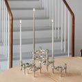The candle holder in a minimalist bedroom setting, adding sophistication.