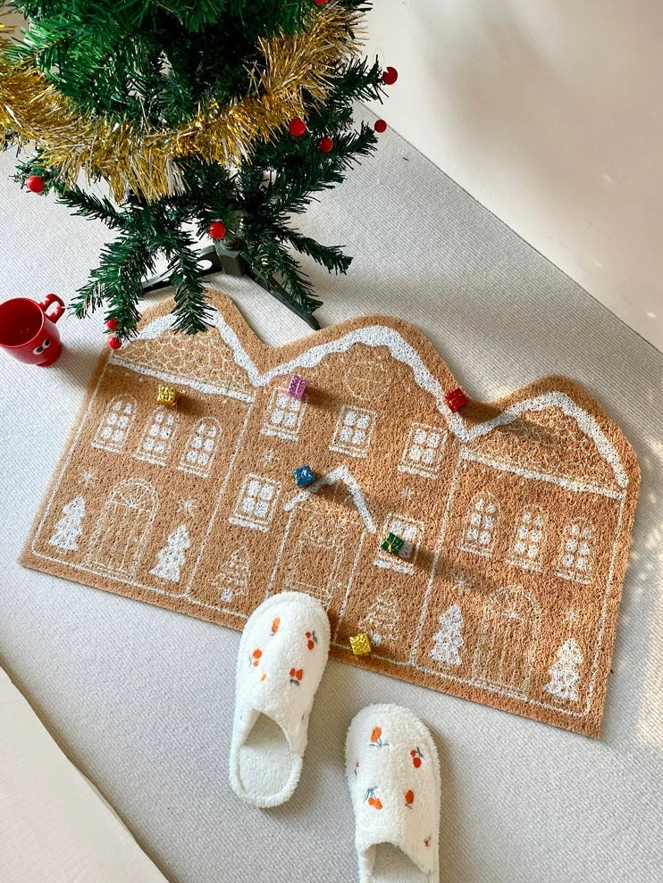 Cinnamon gingerbread Christmas doormat styled beside a decorated Christmas tree