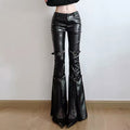 Punk-inspired black flare pants with gothic belt accents