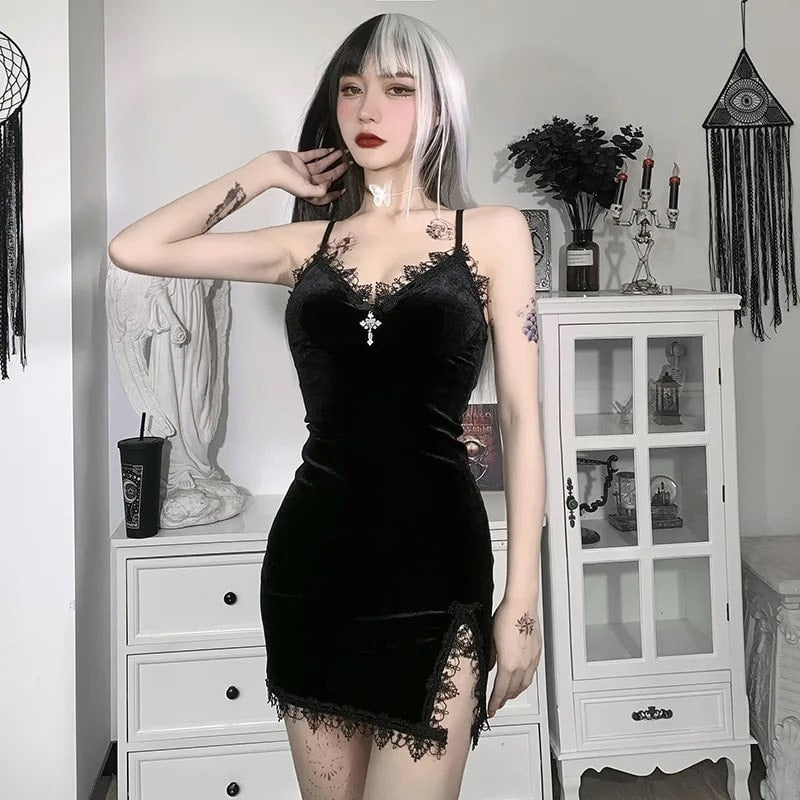 Gothic witch mini dress in black velvet with lace trim. Sexy spaghetti strap design with high-waist slit for Halloween or party events.