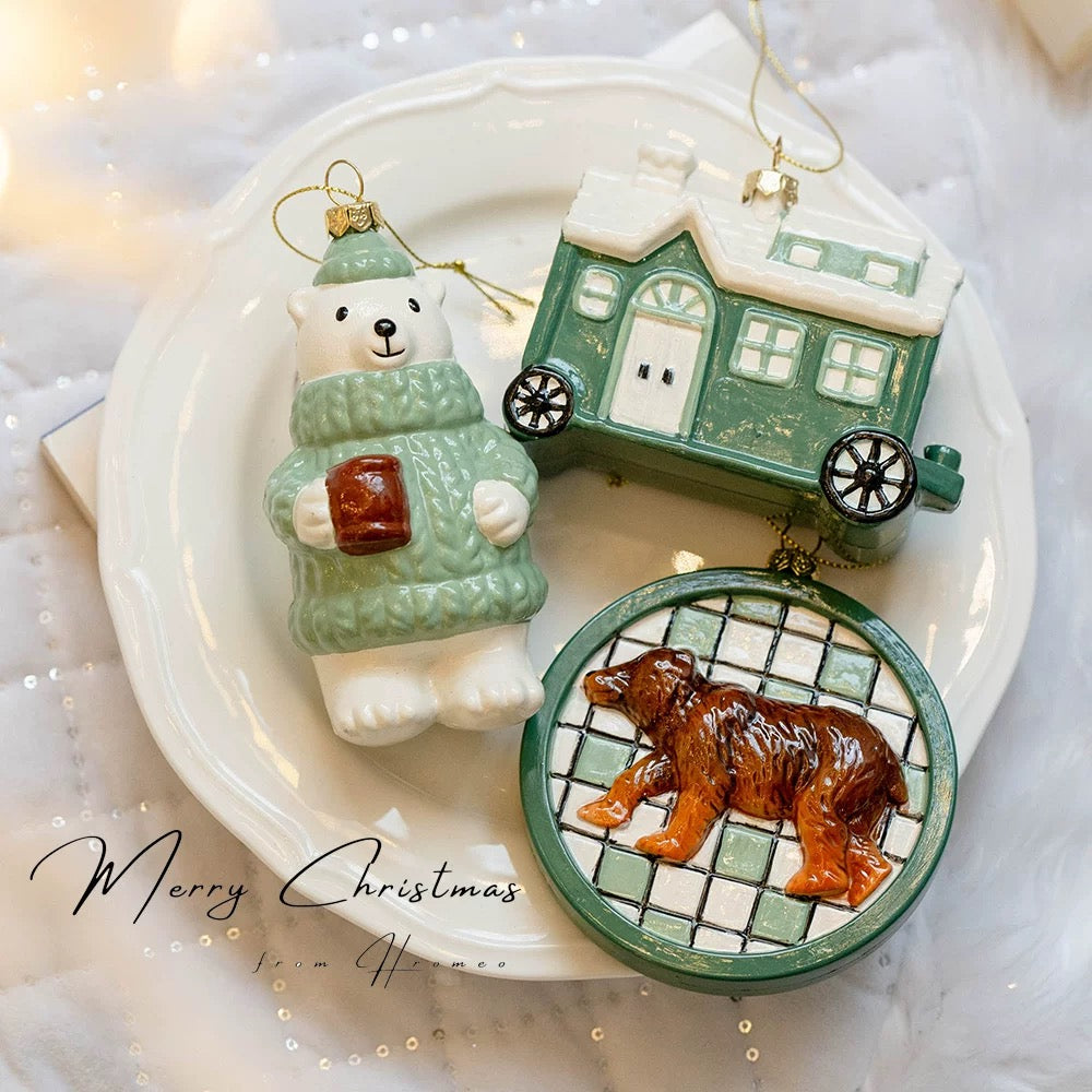 Green Christmas ornaments show a polar bear, a house on wheels and a brown bear on a round checked panel.