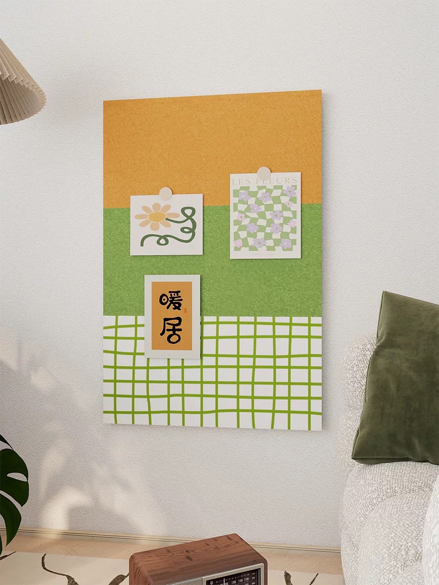 Close view of the green checkered felt pin board with pinned notes above a small table