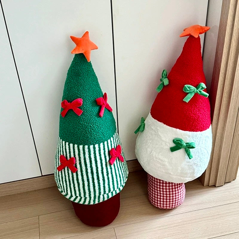 Green and red Christmas tree cushions displayed together in a holiday room