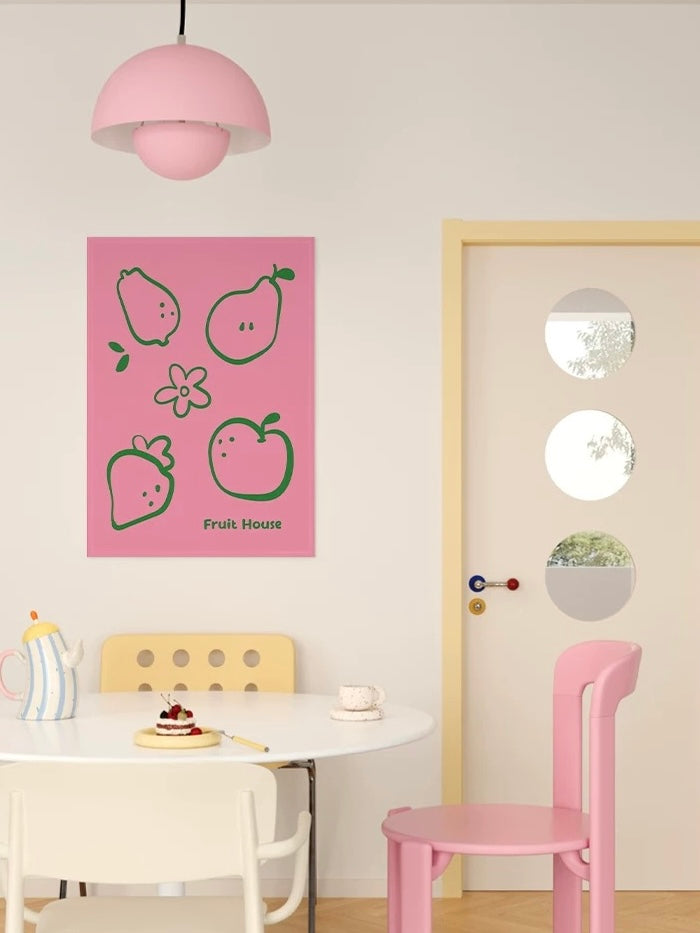 A pink Kawaii tapestry is shown above a small table, with a pink chair and pale door visible beside it.