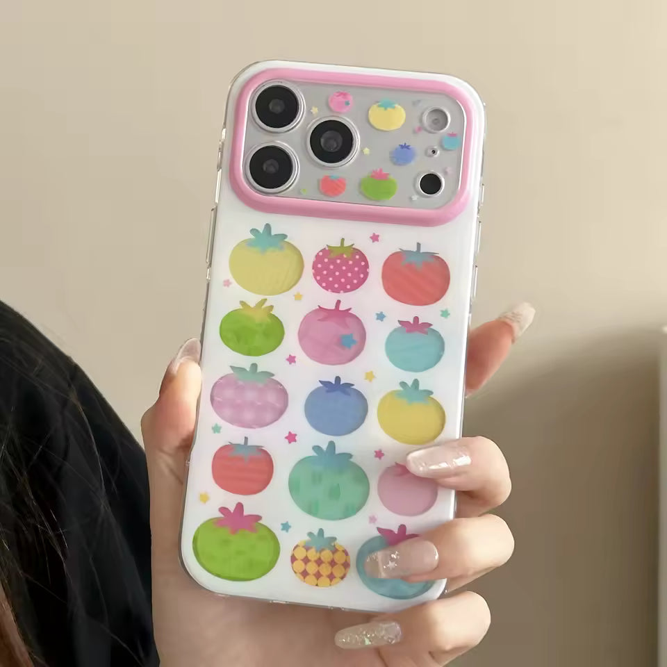 Colorful tomato print silicone iPhone case with pastel fruit illustrations and pink camera frame protection everyday