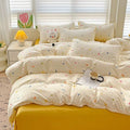 Teen girl dorm room desk next to sunny yellow bedding ensemble