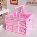 Folding organizer box for room decor used to store journals and tech accessories.