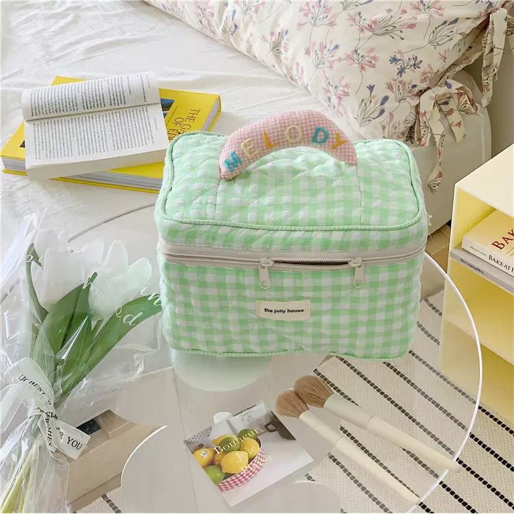 Korean Ins plaid cosmetic bag with top handle, ideal for travel and home use