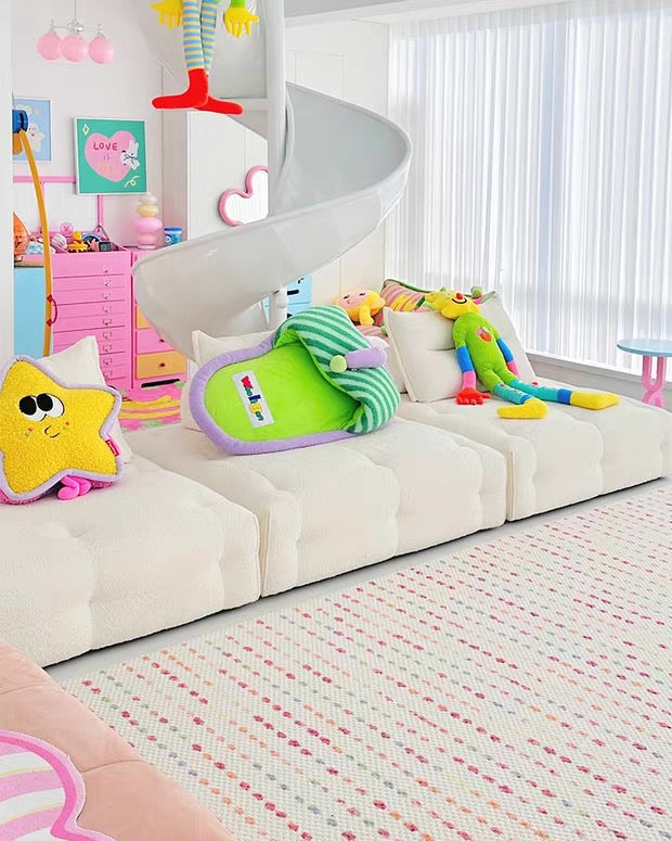 Children's playroom with a slide, toys, and colorful decor.