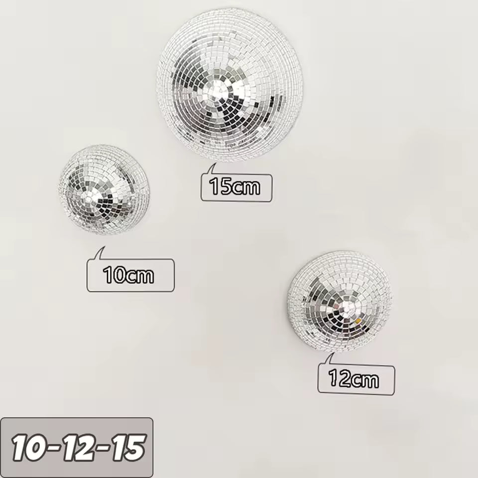 Three disco balls of different sizes with measurements on a white background