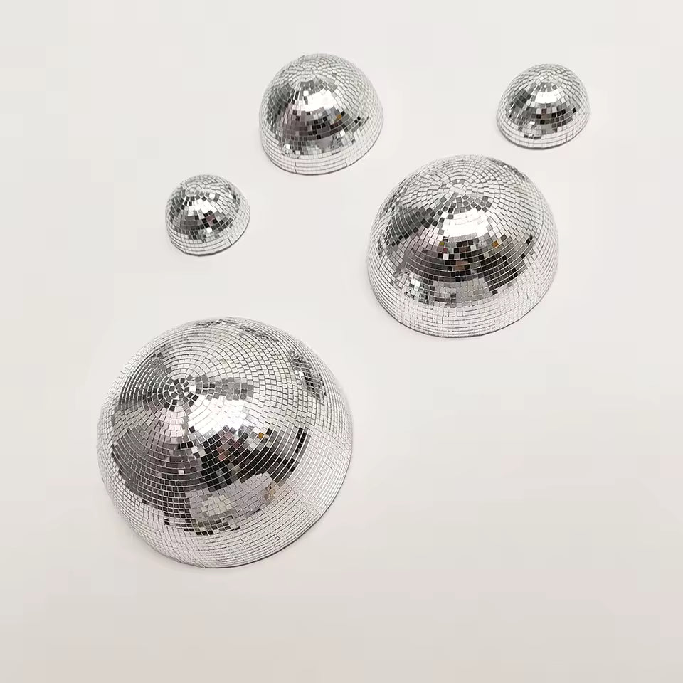 Set of silver disco balls on a white background