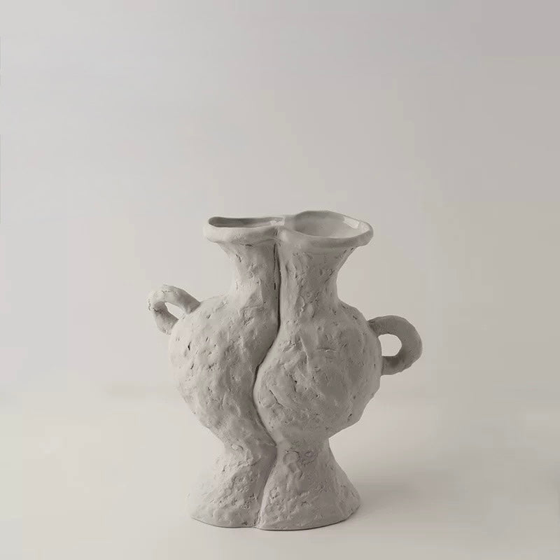 Small gray ceramic vase on a light gray background