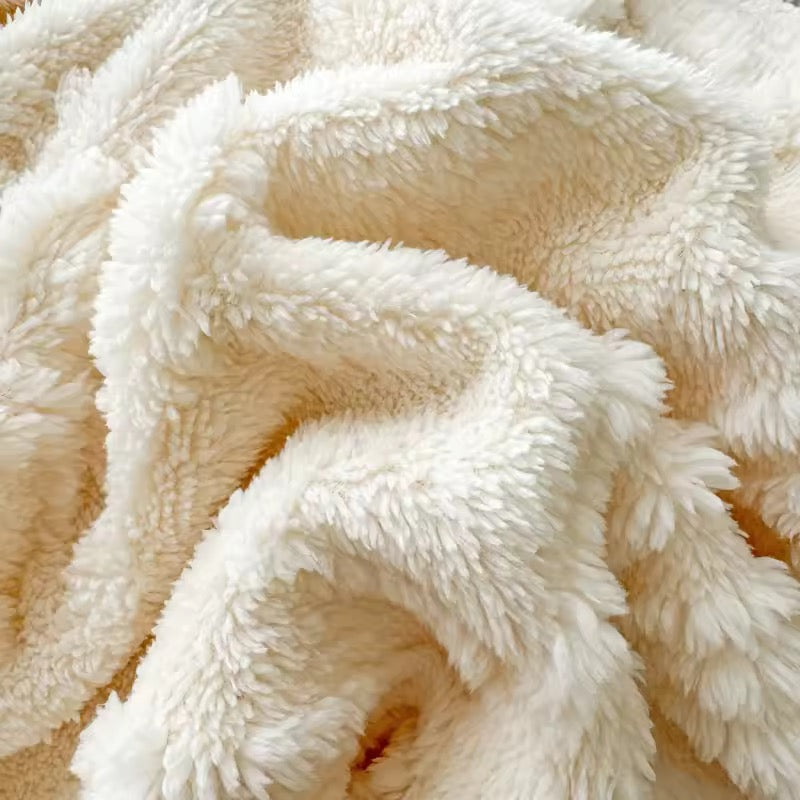 White jacquard butterfly blanket draped over couch