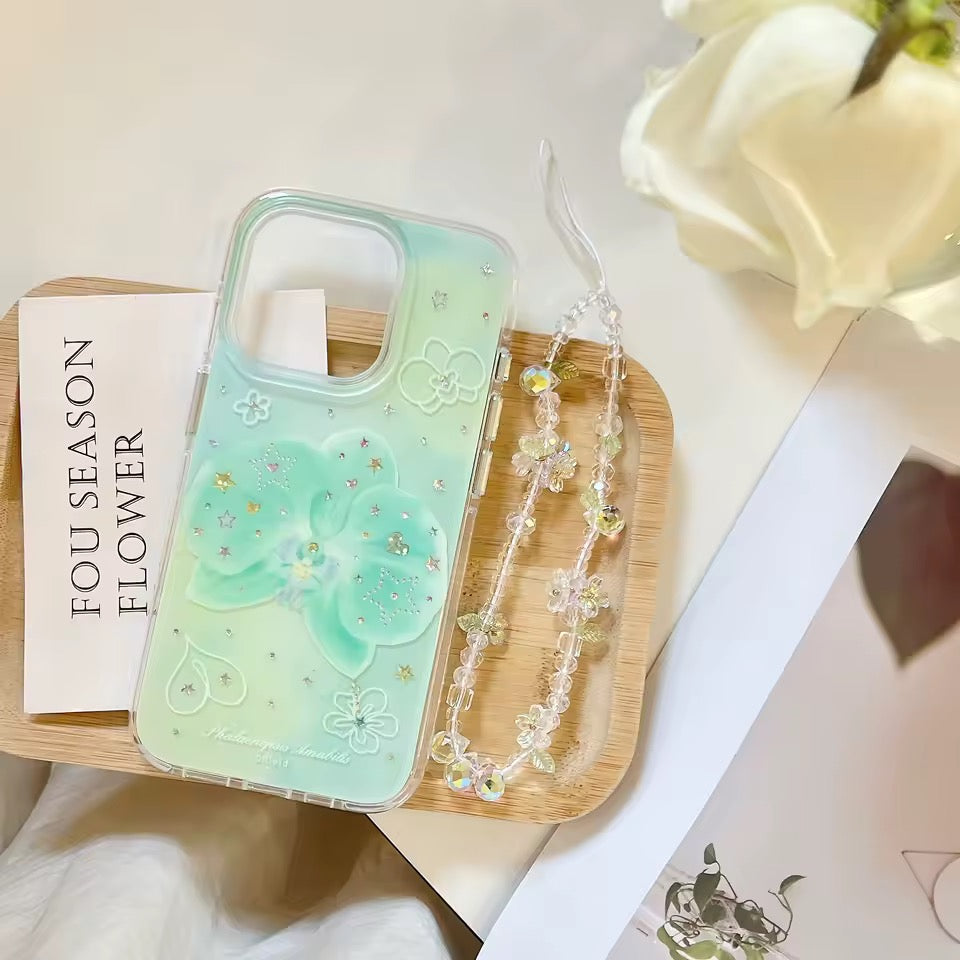 Clear phone case with floral design on a wooden tray