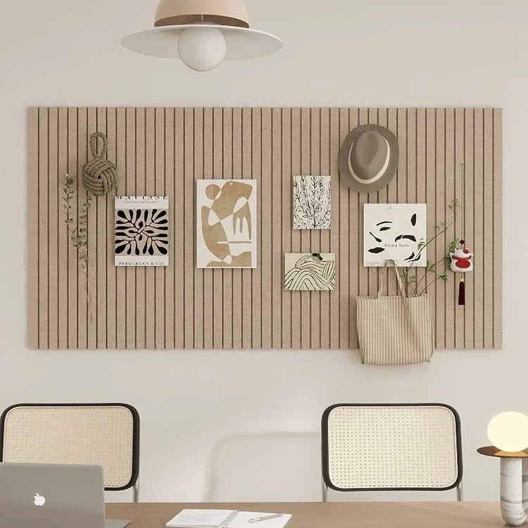 Modern office interior with wooden wall paneling, artwork, and chairs.