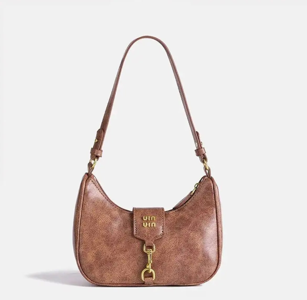 Retro crescent crossbody bag in PU leather. Women’s niche Maillard style bag with zipper closure for daily essentials.