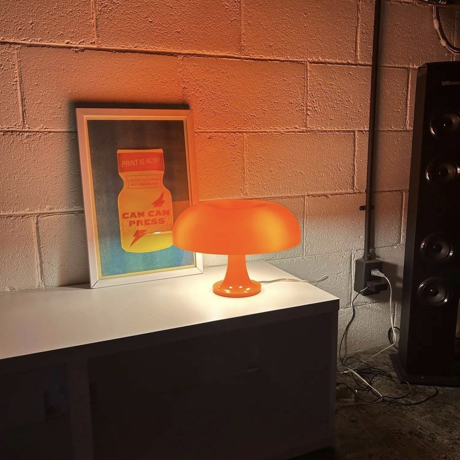 Chic mushroom table lamp in white and orange. Decorative vintage light for bedrooms, desks, and cozy home interiors.