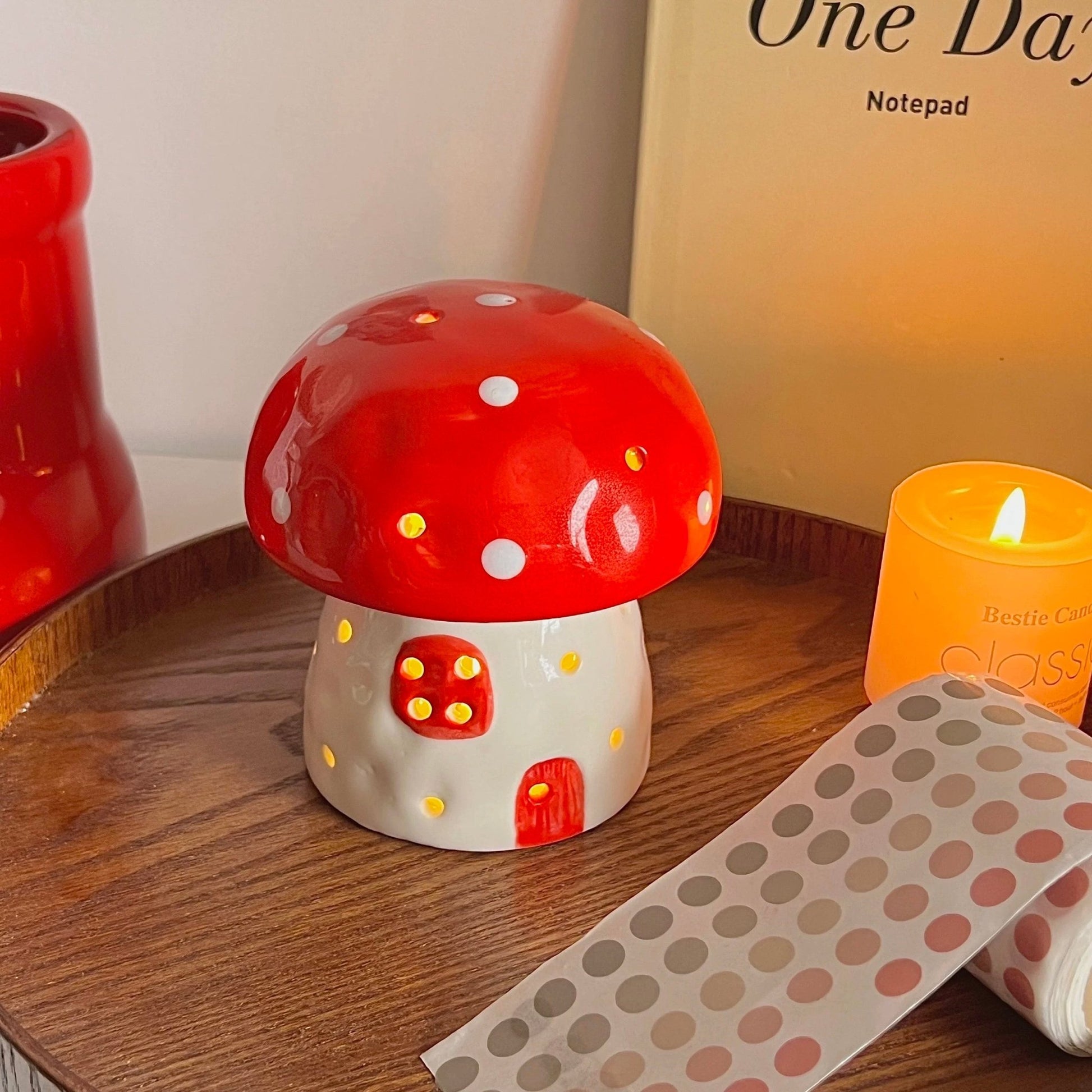 Child’s reading nook lit by pastel pink mushroom LED light